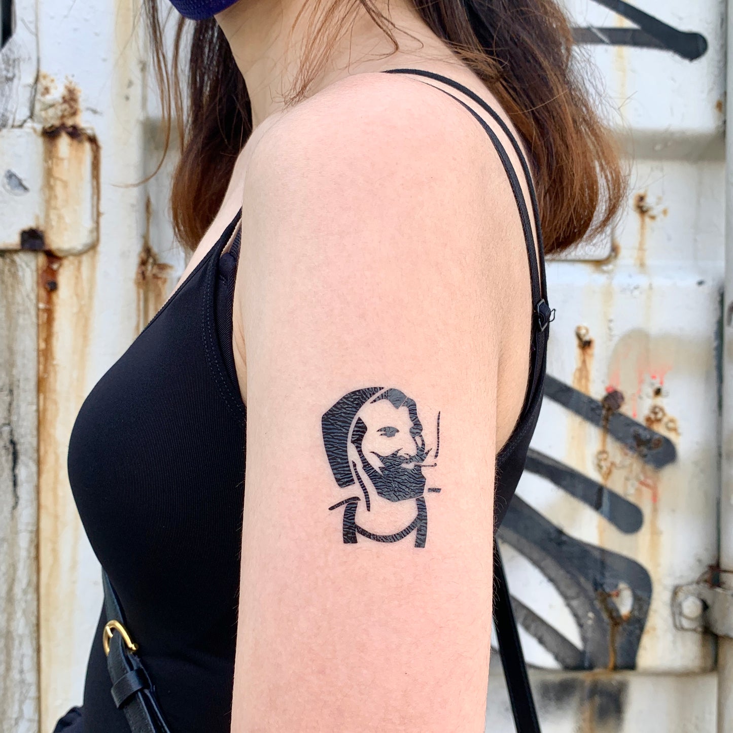 fake small zig zag man smoker art symbol minimalist temporary tattoo sticker design idea on bicep upper arm