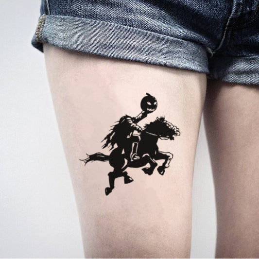 fake big headless horseman pumpkin halloween illustrative temporary tattoo sticker design idea on thigh