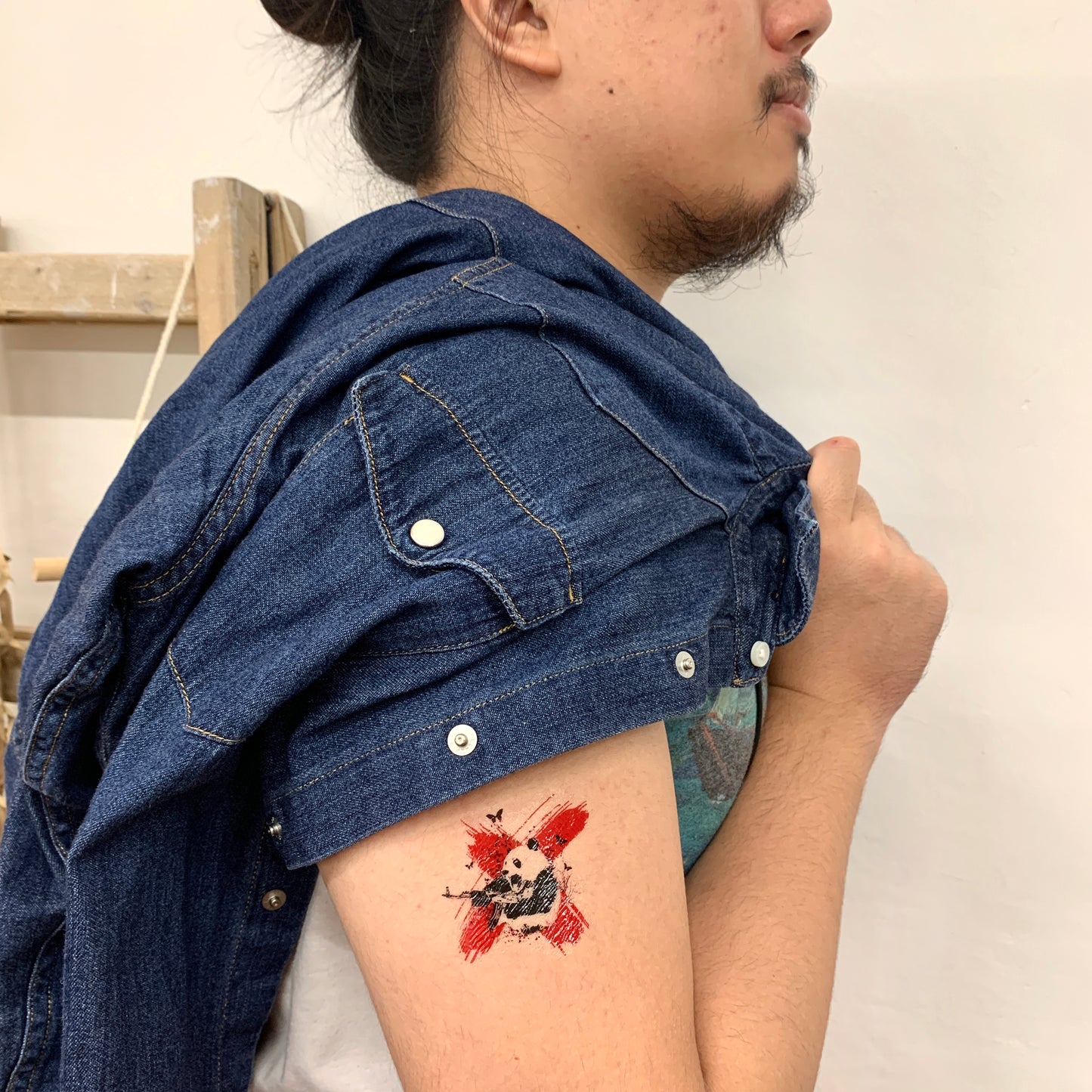 fake small polka dot panda black and red water paint splash animal color temporary tattoo sticker design idea on upper arm