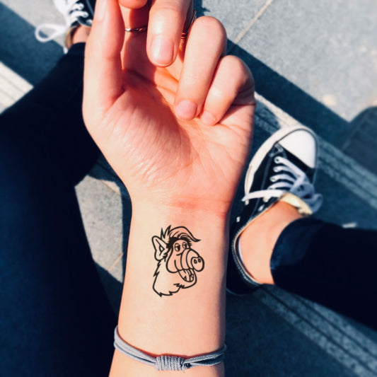 fake small alf cartoon temporary tattoo sticker design idea on wrist