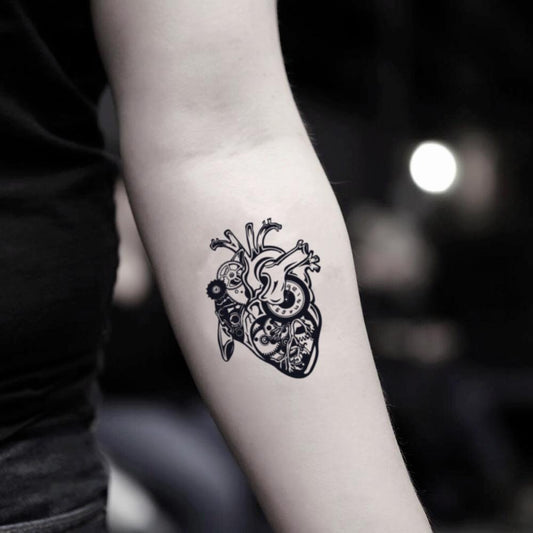 fake small steampunk mechanical heart illustrative temporary tattoo sticker design idea on inner arm