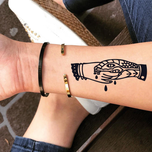 fake small trust no one fake friends handshake snake bite trad illustrative temporary tattoo sticker design idea on wrist